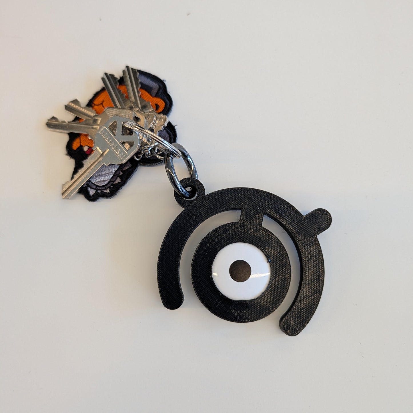 3D Printed Pokemon Unown Airtag Holder with Key Ring - Flexible Plastic - made to order - comes with sticker